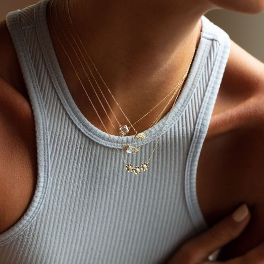 dainty solid gold necklaces layered