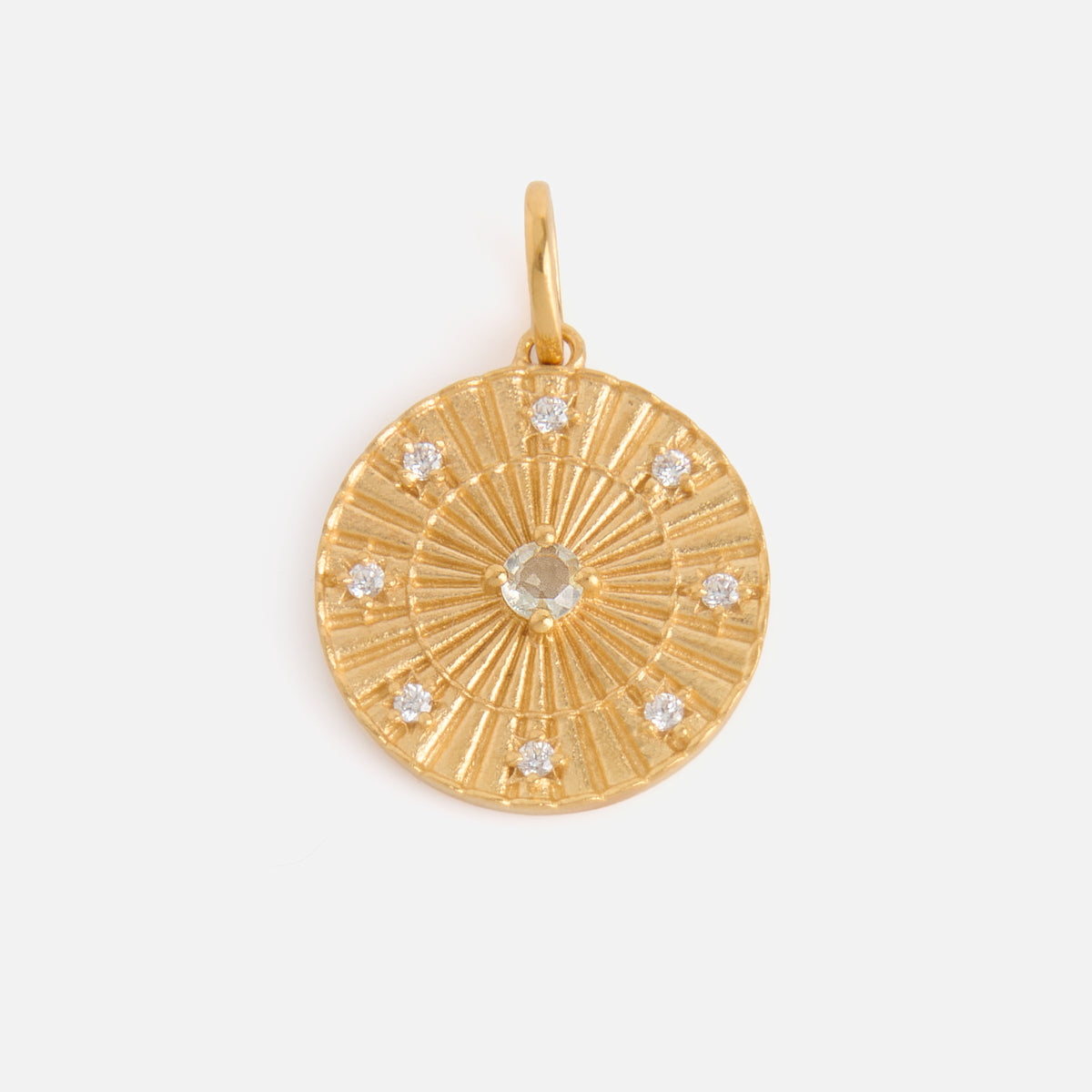 The Charms by Carrie Elizabeth Jewelry pendant features a round, textured 14k gold vermeil design with a central gemstone and eight smaller gemstones around the edge—a striking piece perfect for gemstone jewelry lovers.