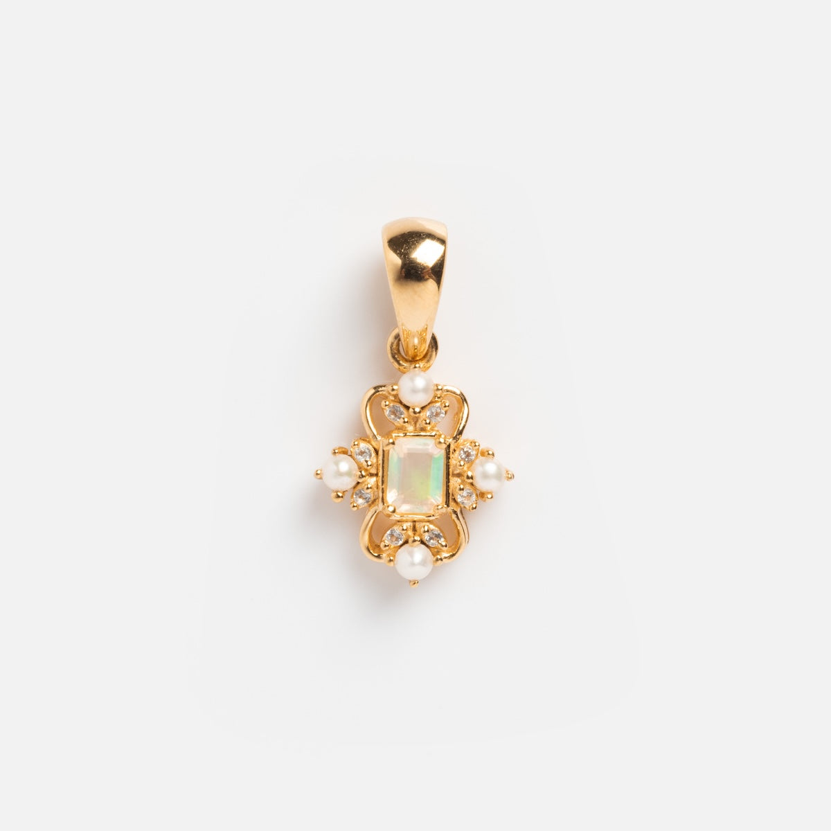 The Vintage Inspired Pendant Charm showcases a rectangular opal center, four small white pearls, and intricate gold detailing, all set in a gold finish and displayed against a plain white background.