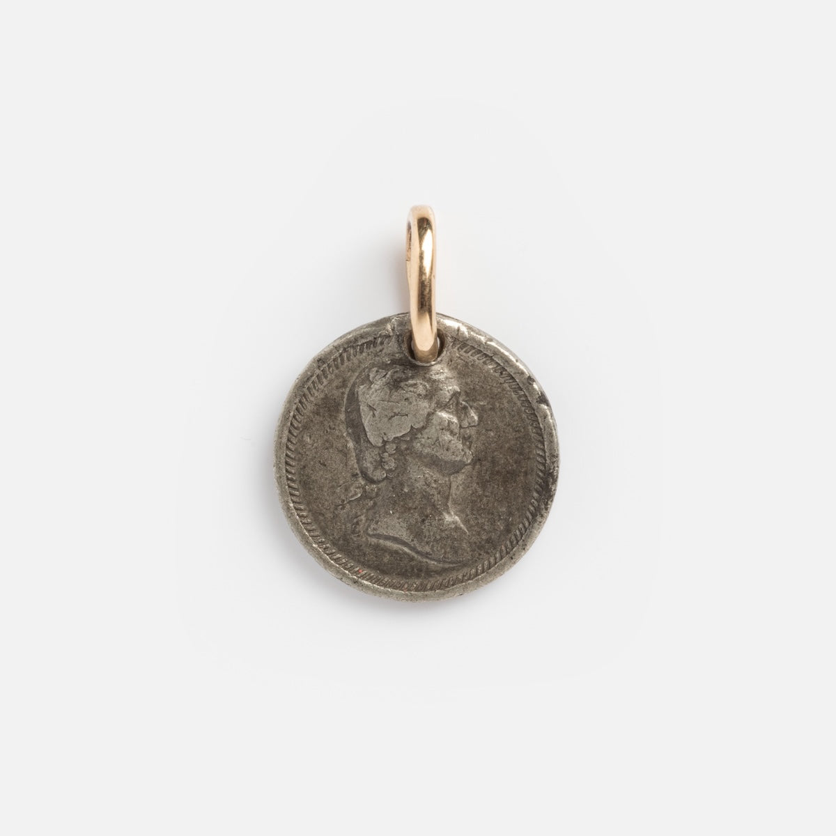 The Vintage 18k President Washington & Lincoln Coin Charm features a round, vintage coin pendant with a worn profile, attached to a small 18k gold loop and set against a plain white background.
