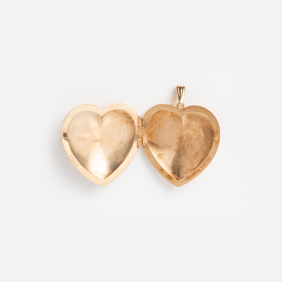 A vintage 14k gold etched heart locket with diamonds is shown open and empty, set against a plain white background.