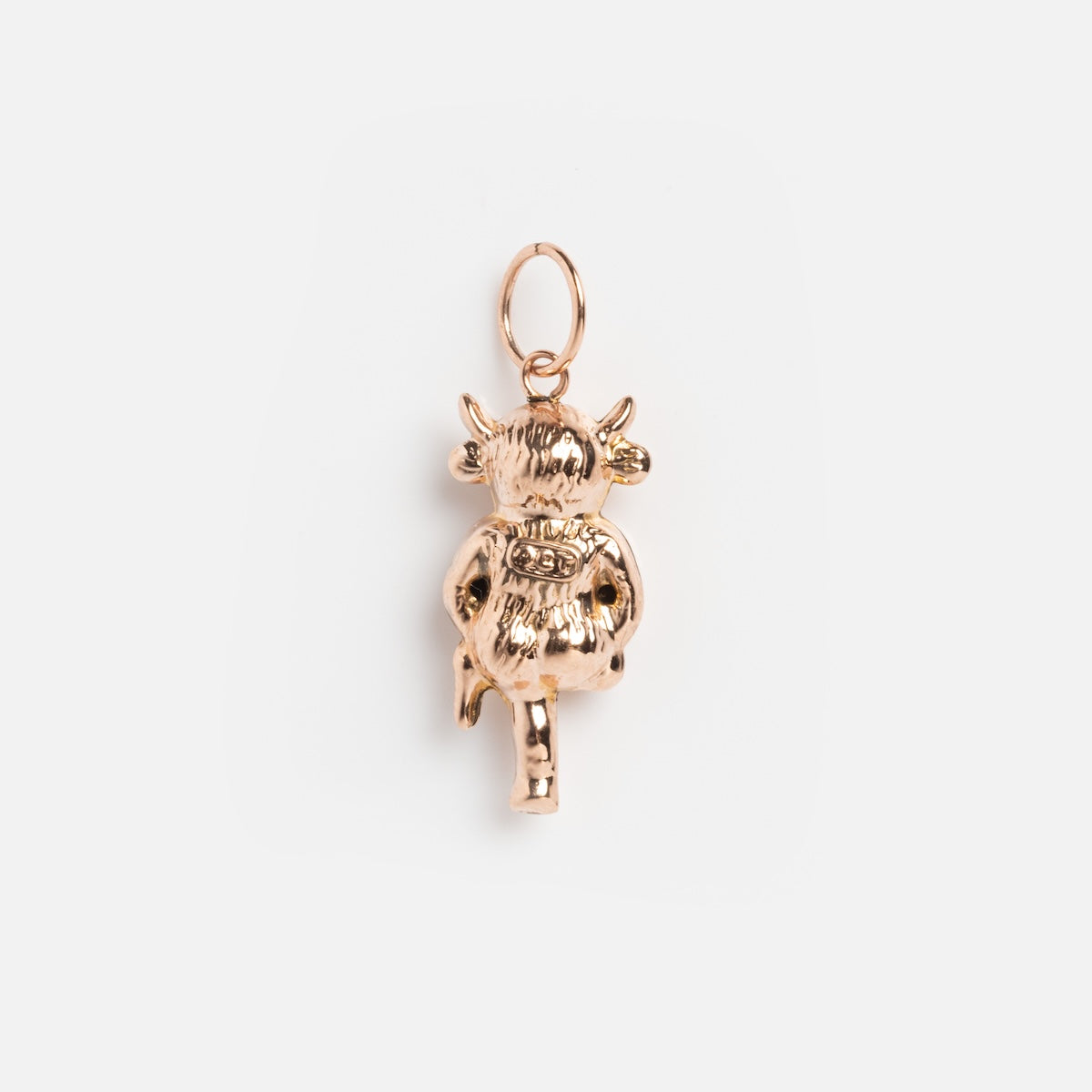 A vintage 9k yellow gold Lincoln Imp charm from the 1920s, showcasing intricate craftsmanship and a top loop for easy attachment to jewelry, displayed on a plain white background.