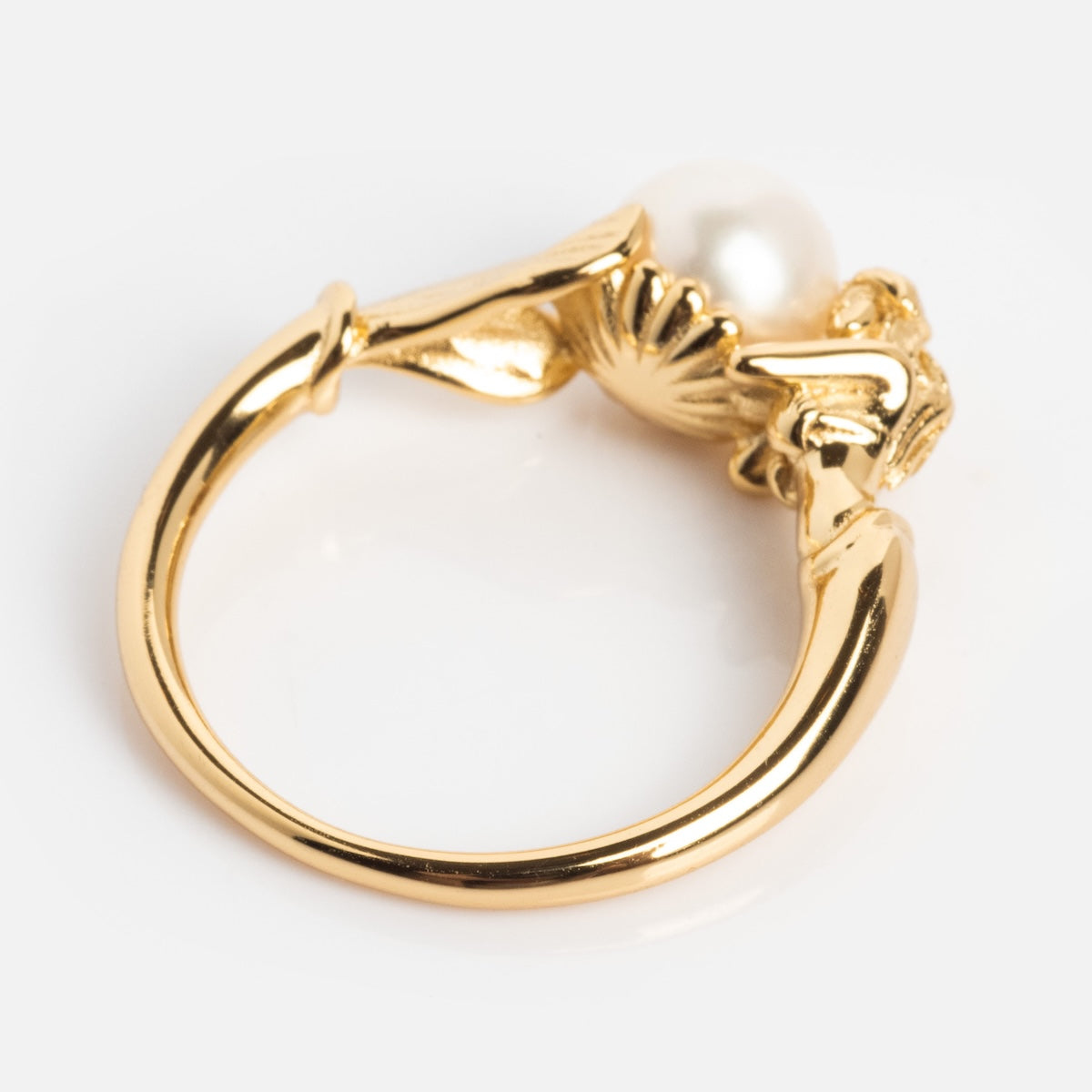 The Pearl Siren Statement Ring features a vintage-inspired, ornate sculpted band with leaf motifs and a single round white pearl centerpiece, shown against a white background.