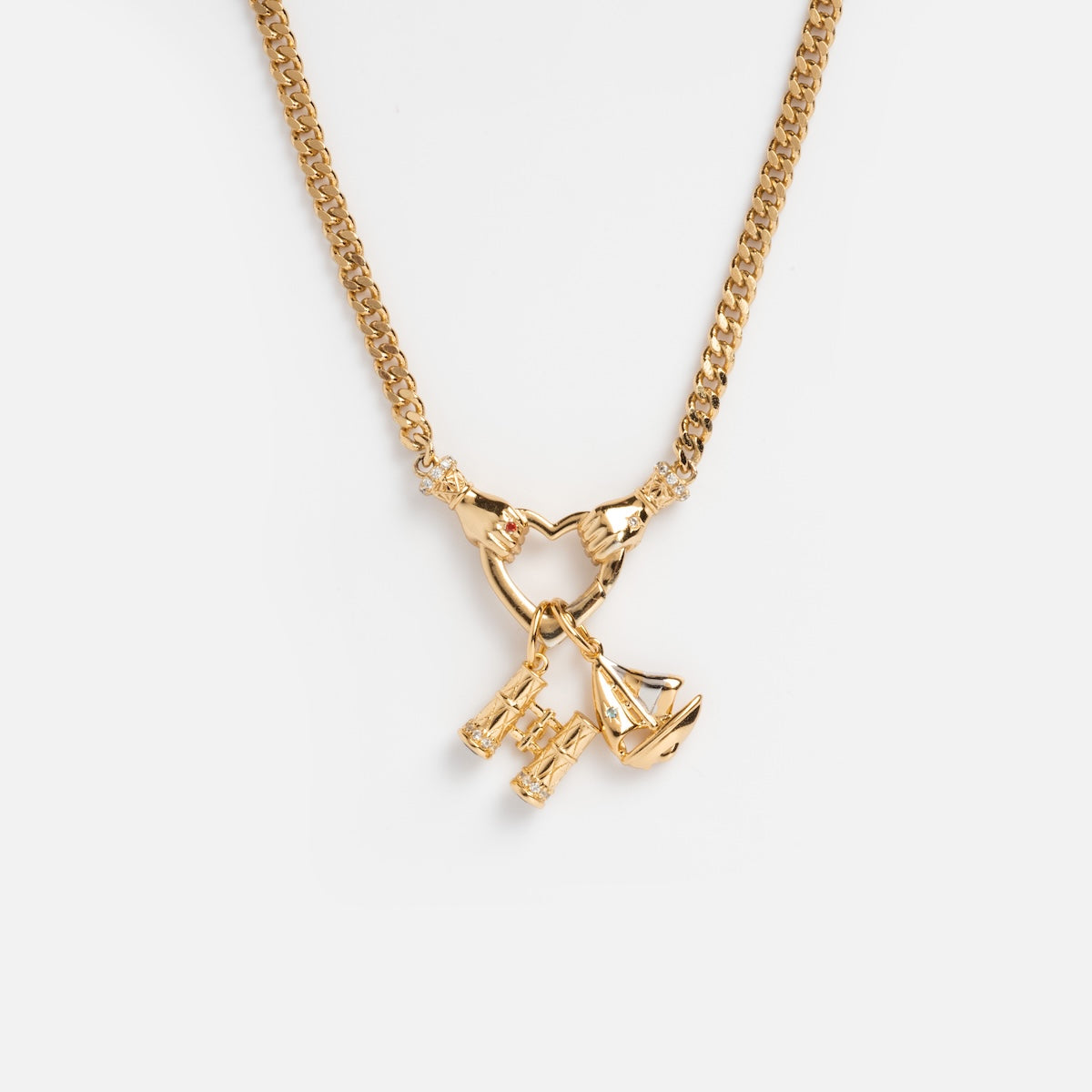 The Hand Over Heart Charm Holder Necklace in 14k gold vermeil features handshake, scale, and binocular charms, elegantly displayed on a plain white background.