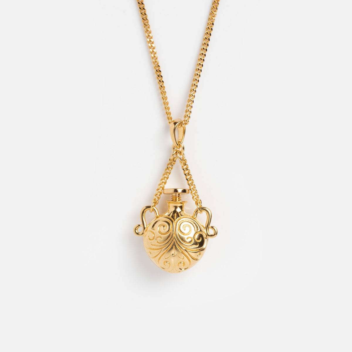 The Juliet Vial Pendant Necklace is a gold pendant necklace with a delicate round vial, perfect for fans of vintage-inspired jewelry.