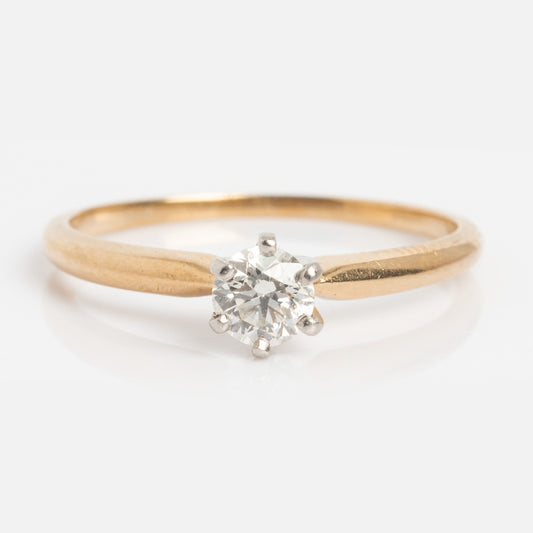 Vintage 14k 1960s Solitaire Round Diamond Engagement Ring, size 5.5, features a single round diamond in a classic six-prong setting on a white background.