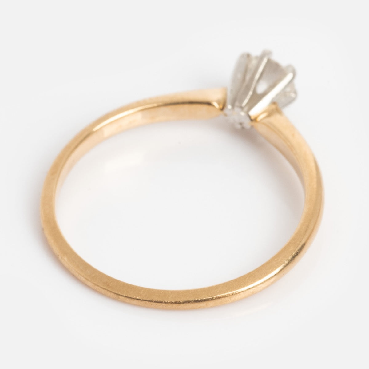 A Vintage 14k 1960s Solitaire Round Diamond Engagement Ring, size 5.5, shown with a raised prong setting on a plain white background.