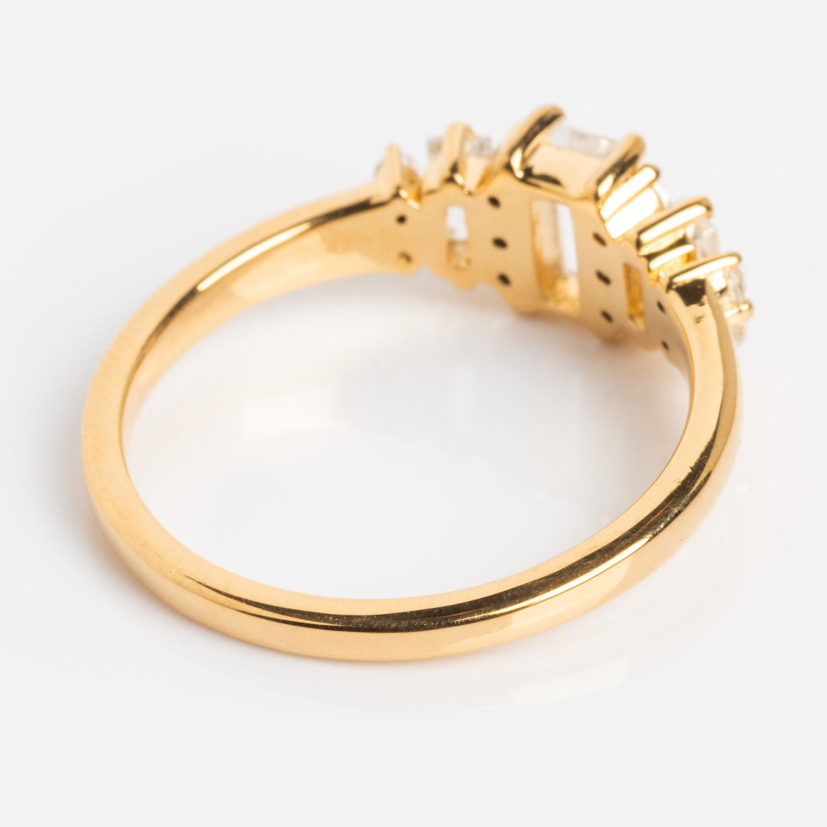 The Third Act Art Deco Ring is a vintage-inspired 14k gold vermeil ring with clear, rectangular gemstones in a raised prong setting, shown on a white background.
