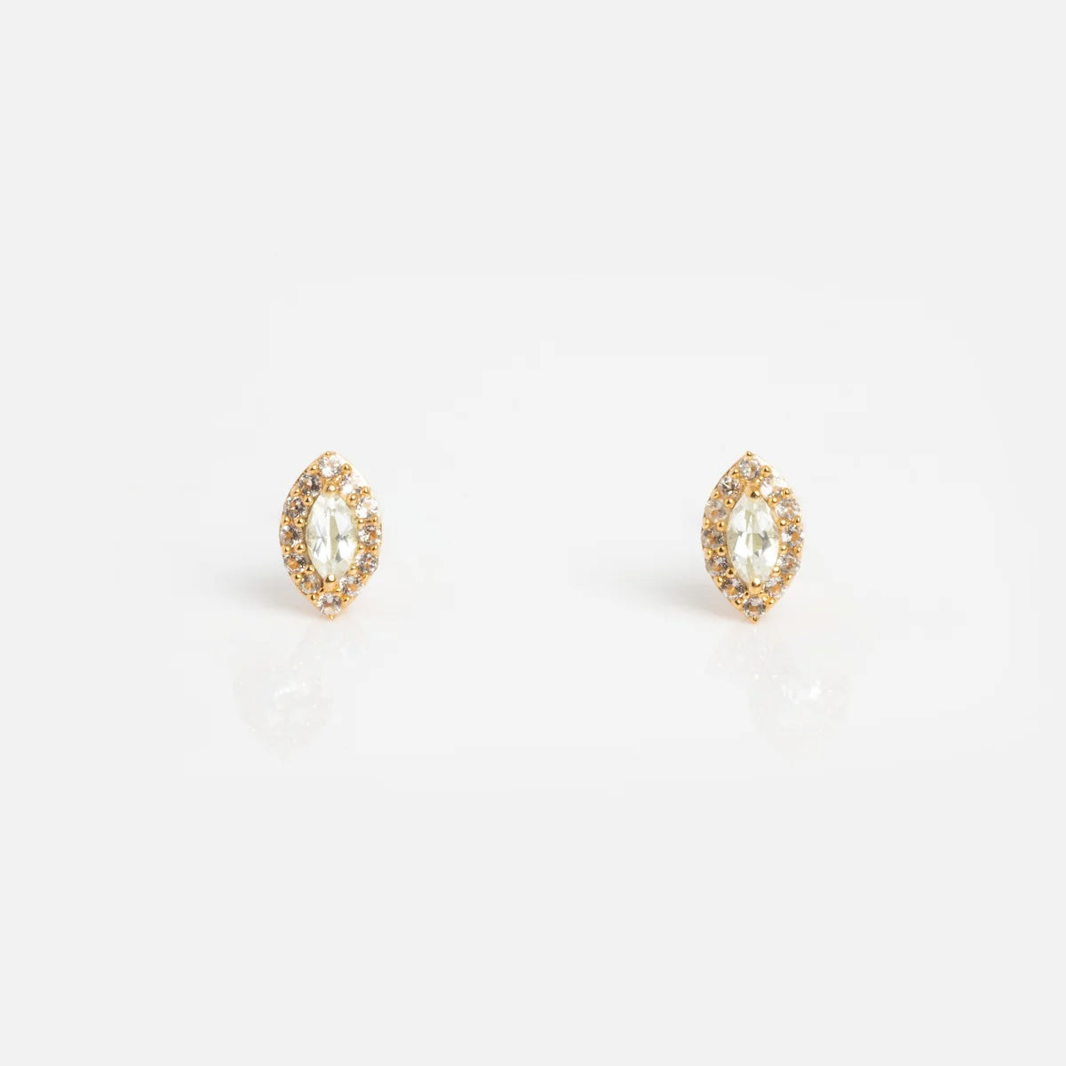 The Green Amethyst Marquise Muse Studs are vintage-inspired 14k gold vermeil earrings with marquise shapes, each featuring a central green amethyst surrounded by sparkling stones, shown on a white background.