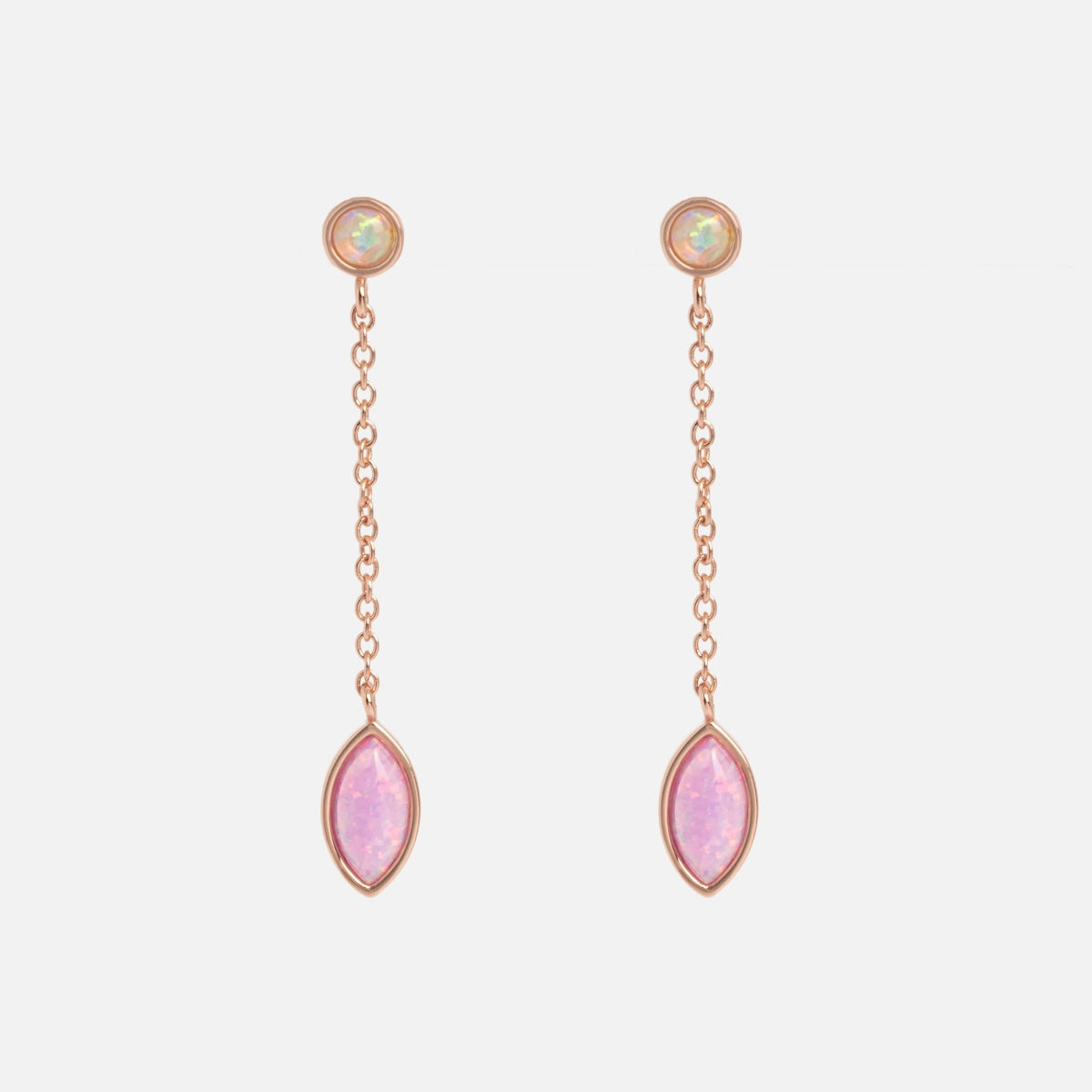 The Rose Gold Opal Dew Drop Studs feature a small round opal stud paired with a delicate chain ending in a marquise-shaped pink gemstone.