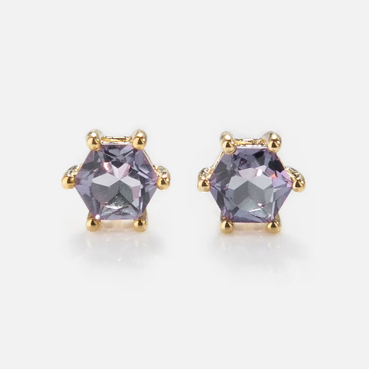 Solid Gold Modern Birthstone Studs: yellow gold stud earrings with round, faceted purple gemstones set in six prongs, shown on a white background.