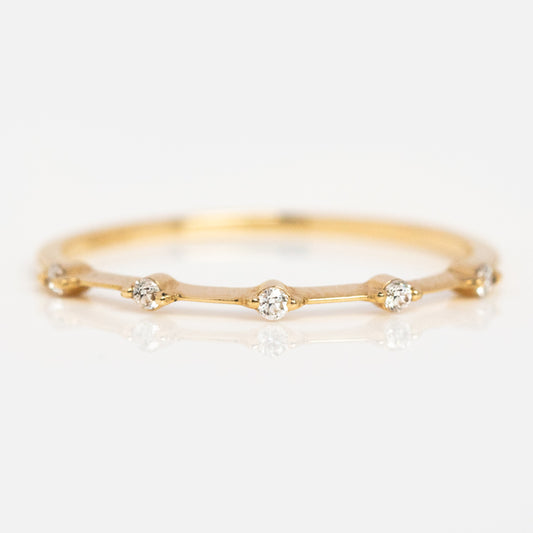 The 14k Diamond Constellation Band features six evenly spaced lab-created diamonds set along a thin recycled gold band, shown on a white background.
