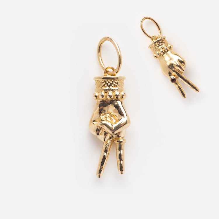 The Solid Gold Body Language Charm features two hand-shaped designs—one flashing a peace sign, the other holding a tiny object. Each charm comes with an attachment ring. Available exclusively at Local Eclectic, shown on a simple white background.