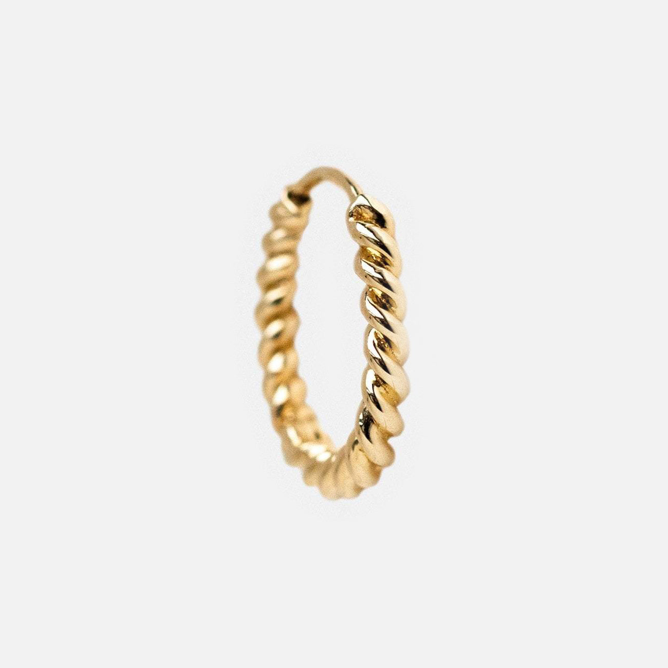 Solid Gold Twisted Huggie Hoops in 10k gold, featuring a twisted rope design and ideal for everyday wear, displayed on a plain white background.