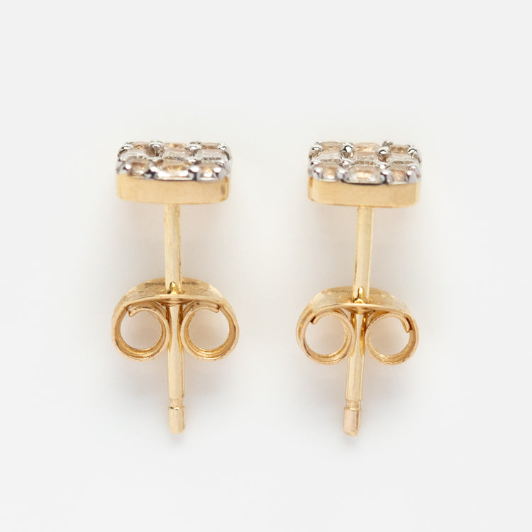 Solid Gold Art Deco Studs: Vintage gold earrings with square tops, each adorned with a cluster of sparkling stones, shown on a white background.