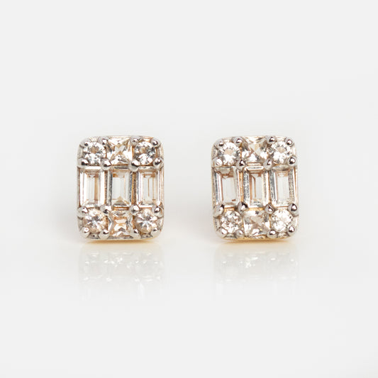 Solid Gold Art Deco Studs with round and baguette diamonds in a geometric design, these vintage gold earrings are shown on a white background.