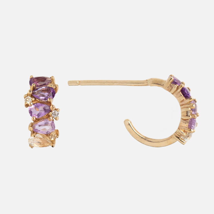 Solid Gold Ombre Birthstone Huggie Hoops in 9k gold, featuring purple and light yellow gemstones, displayed from the front and side on a white background.