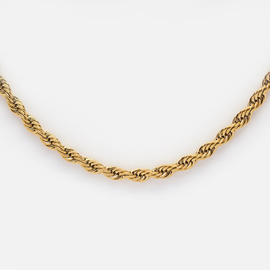 The Bold Rope Chain Necklace is shown close-up against a white background. Made from gold plated stainless steel, it boasts a twisted rope design with a polished finish—perfect for layering.