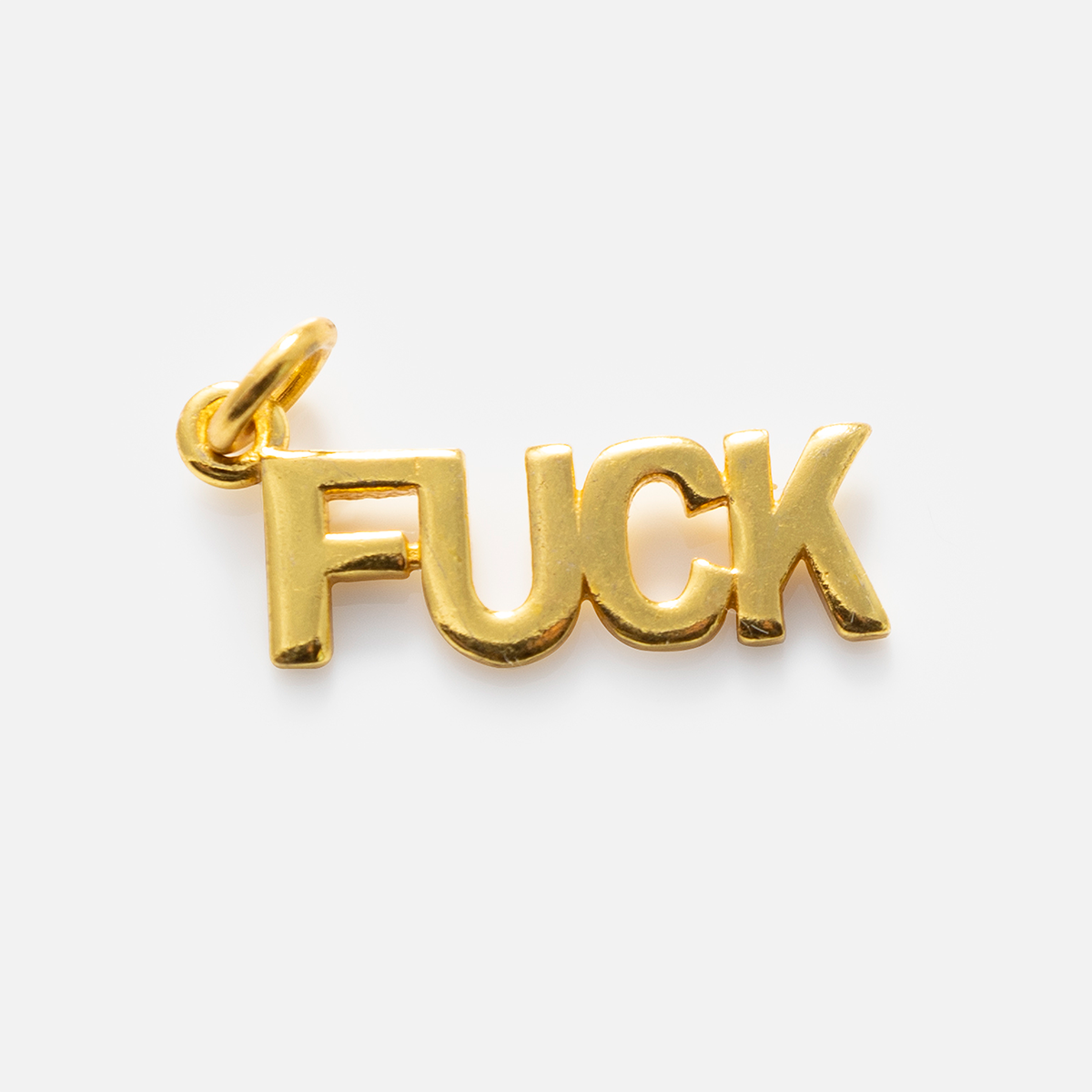 Charms by Anokhi Green: A gold-plated pendant featuring the word FUCK in bold capitals, with a loop for easy attachment—ideal to pair with your favorite cubic zirconia necklace.