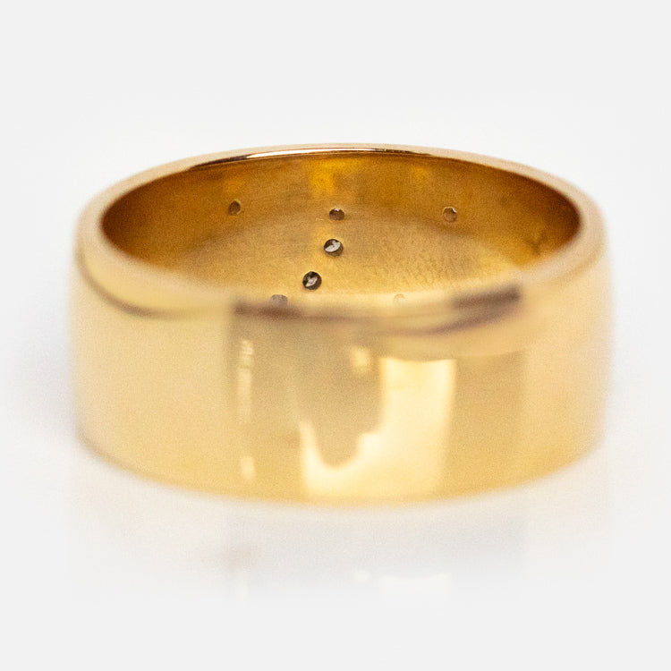 The Solid Gold Diamond Night Sky Cigar Band, exclusive to Local Eclectic, is shown upright on a white background with a smooth shiny exterior and small interior marks.