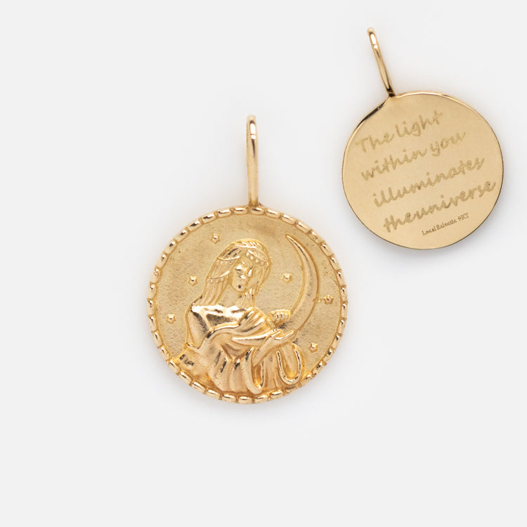 The Solid Gold Coin Charm: one features a woman with wheat and stars, the other reads The light within you illuminates the universe. A Local Eclectic exclusive—ideal for fans of personalized jewelry.