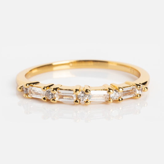 The Multi Gem Baguette CZ Stacking Ring is a 14K gold plated band with alternating round and rectangular clear gemstones set in a row, shown on a white background.