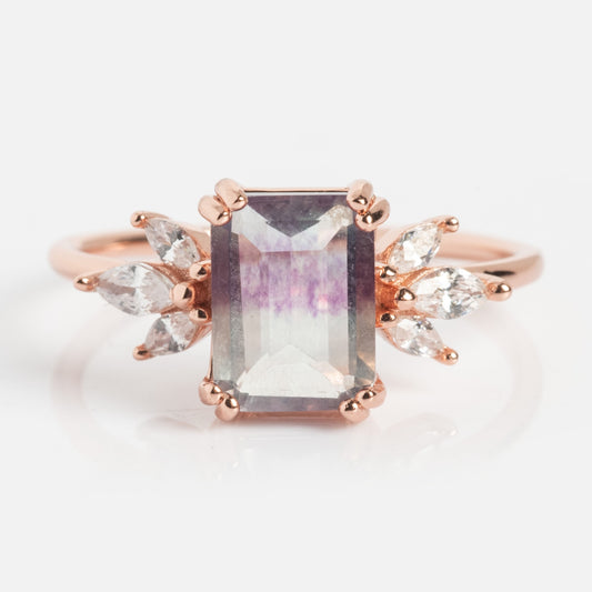 A Local Eclectic exclusive, the Rose Gold Fluorite Topaz Hazy Dream Ring showcases a rectangular multicolored fluorite gemstone with marquise-cut clear topaz clusters, all set in rose gold vermeil.