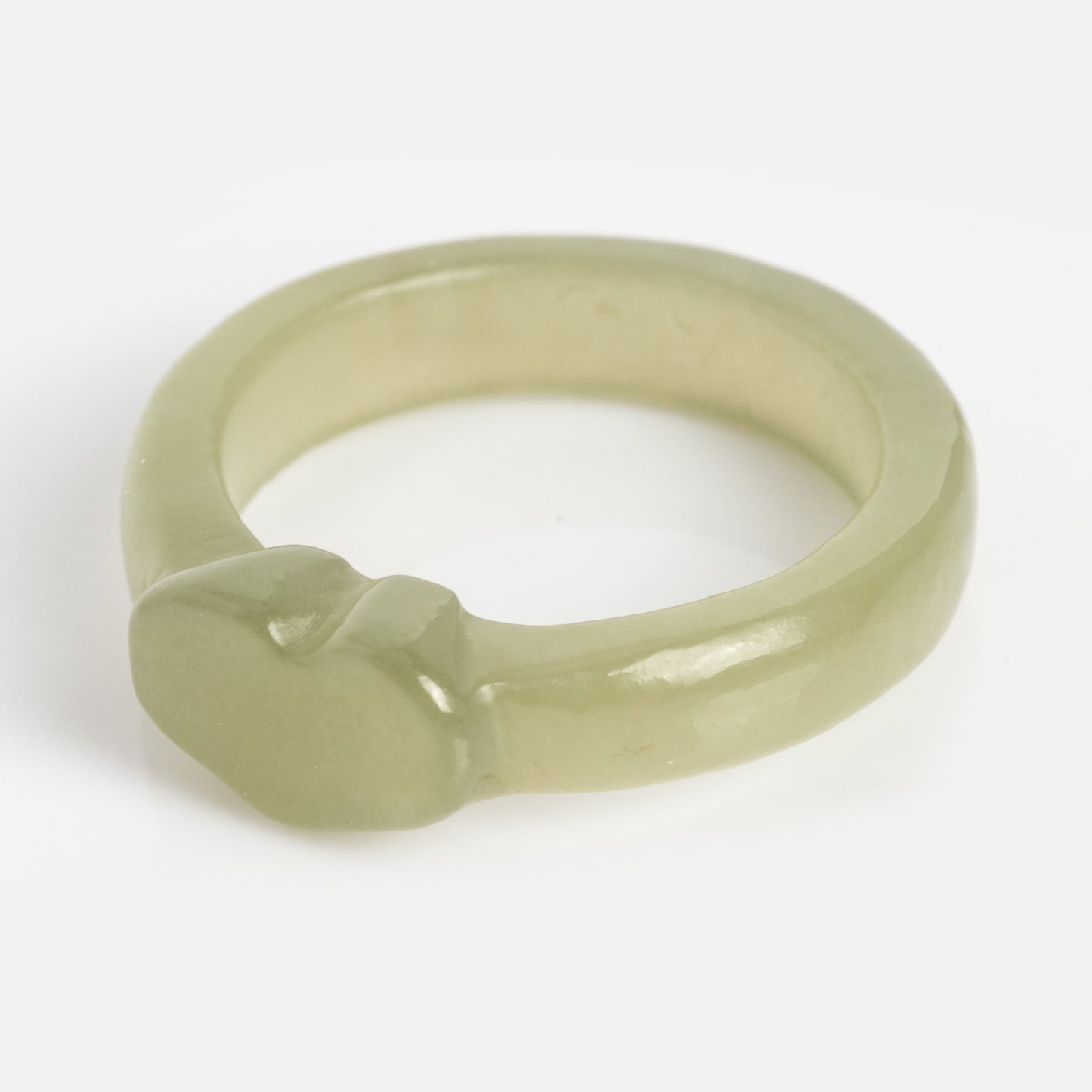 A light green, translucent Heart Jade Ring with a simple, rounded 3.5 mm band and a smooth, oval bezel, displayed on a plain white background.
