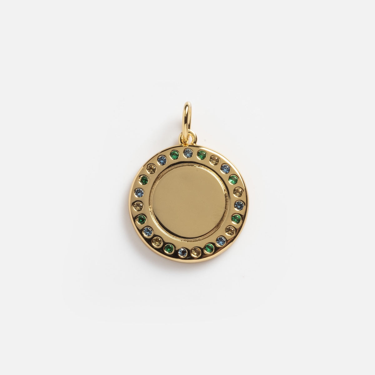 The Classic Gem Coin Charm Sample is a round gold pendant with a blank center, encircled by blue, green, and yellow gemstones, and features a gold loop at the top for attaching to a chain.