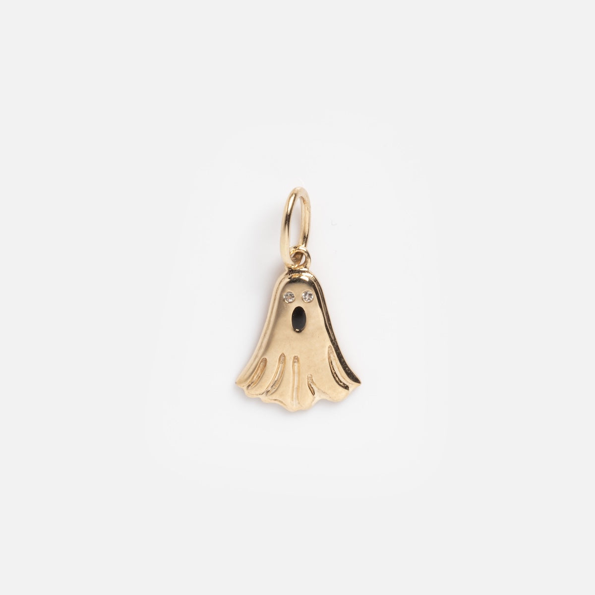 The Solid Gold Ghost Charm Sample features a ghost-shaped gold pendant with two sparkling eyes, a dark oval mouth, and a small loop, all displayed against a plain white background.