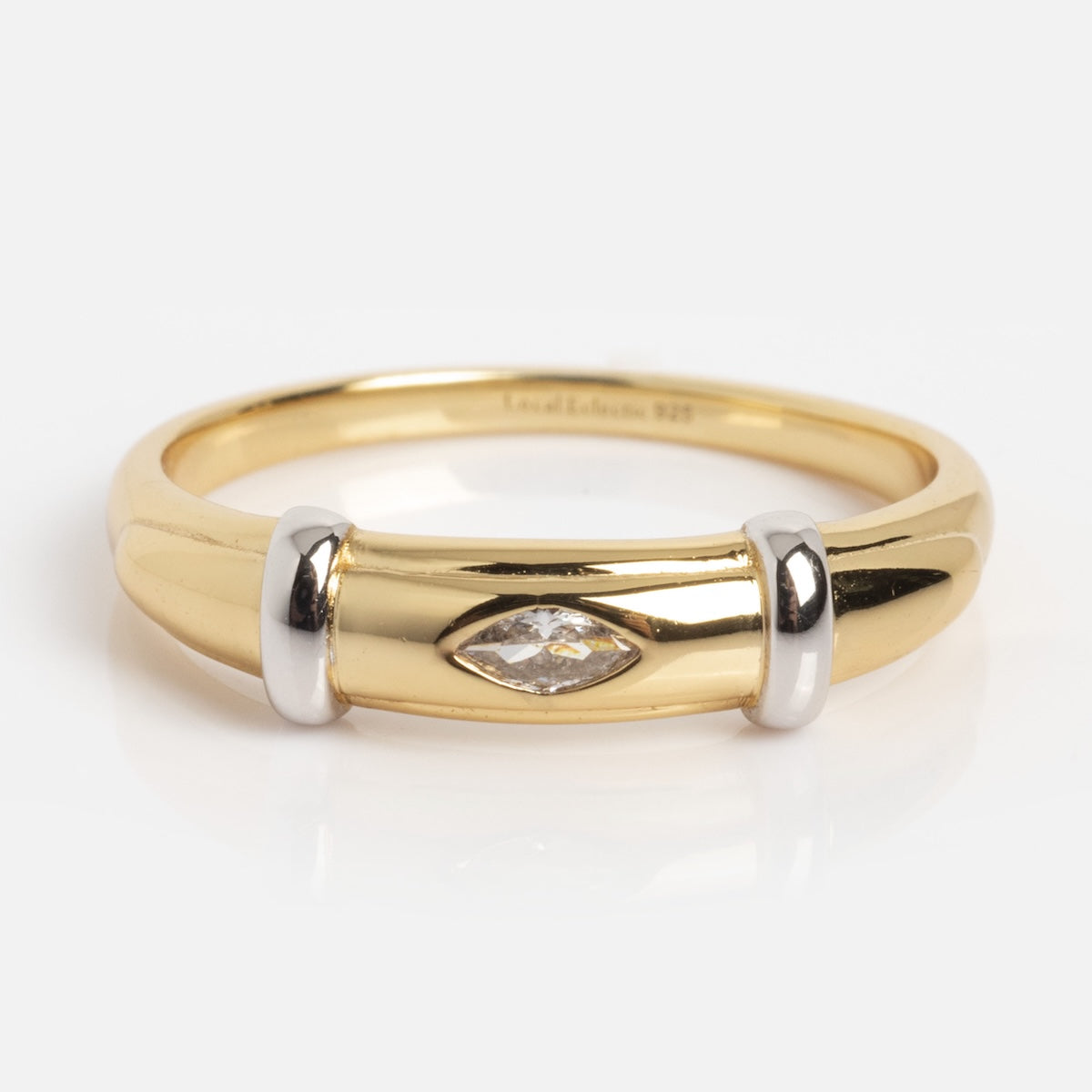 The Mixed Metal Deco Ring Sample Size 7 features a marquise-cut white CZ centerpiece, two silver accent bands on each side, and is crafted from 14k yellow gold vermeil over a silver base, displayed on a plain white background.