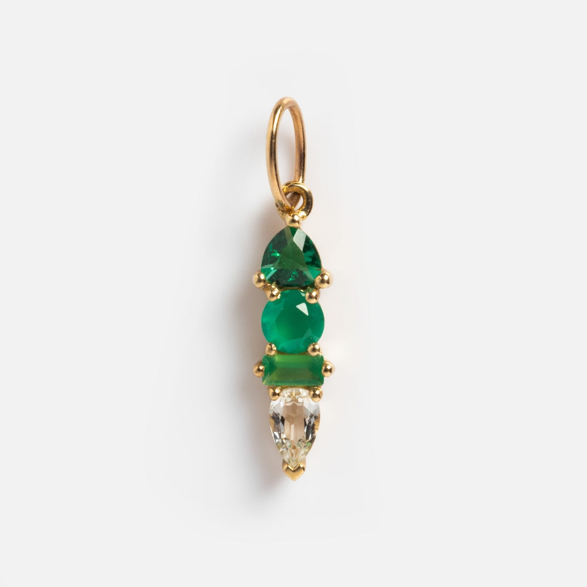 Introducing the Solid Gold Modern Ombre Birthstone Charm: a stunning gold pendant with two uniquely shaped green stones above a clear teardrop gemstone, all set in gold prongs—a distinctive and elegant birthstone charm.