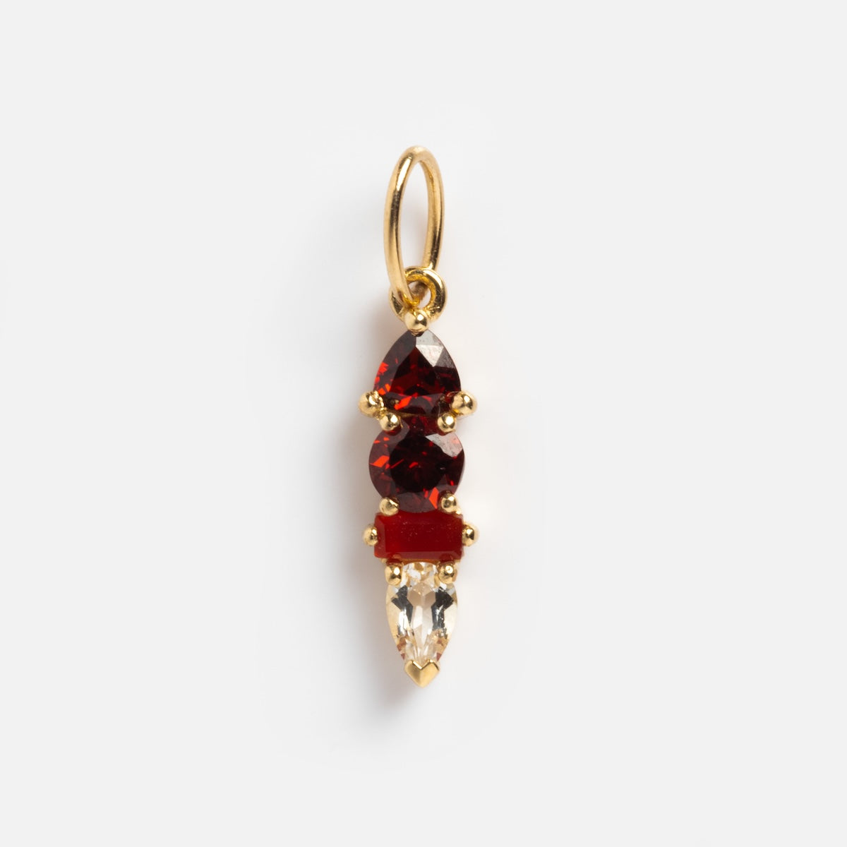 The Solid Gold Modern Ombre Birthstone Charm features three red stones stacked above a clear teardrop gemstone, all set in gold prongs with a gold loop—an elegant charm for any occasion.