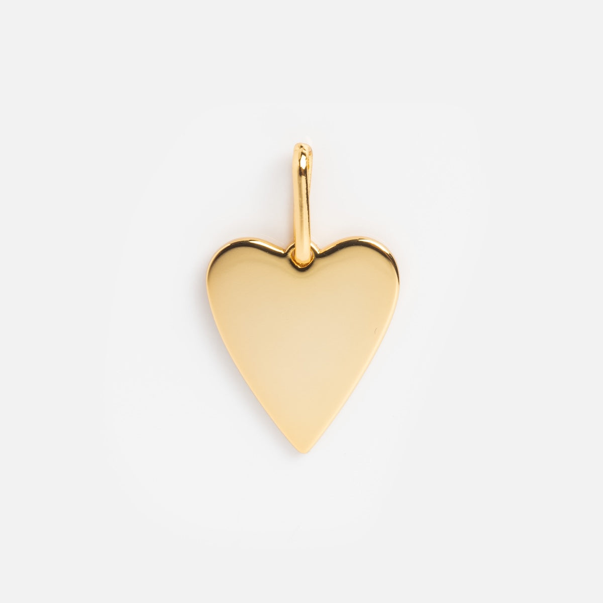 The Charms by Thatch pendant features a shiny gold heart shape with a smooth finish and a small top loop for attaching to your chain, ideal for personalized necklace charms, displayed on a plain white background.