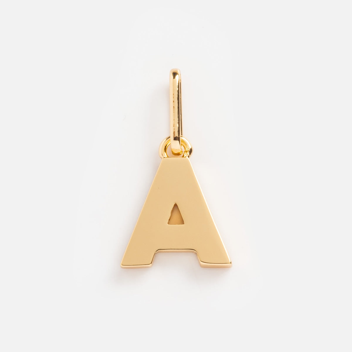The Be You Initial Charm is a gold pendant shaped like a capital A, featuring a small top loop for attaching to a necklace. Shown on a plain white background.