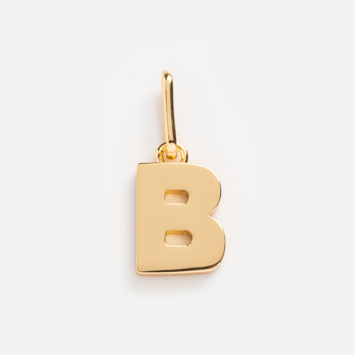The Be You Initial Charm is a gold pendant shaped like a capital B, featuring a small loop for easy attachment to a chain—ideal for personalized jewelry. Shown on a plain white background.