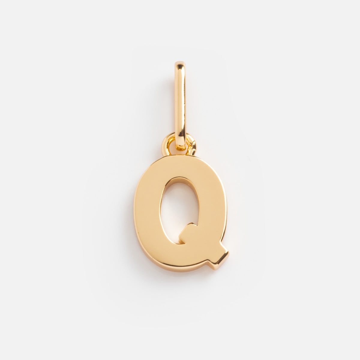 The Be You Initial Charm is a gold Q-shaped charm with a small loop for attaching to bracelets or necklaces—ideal for personalizing your jewelry, shown on a plain white background.