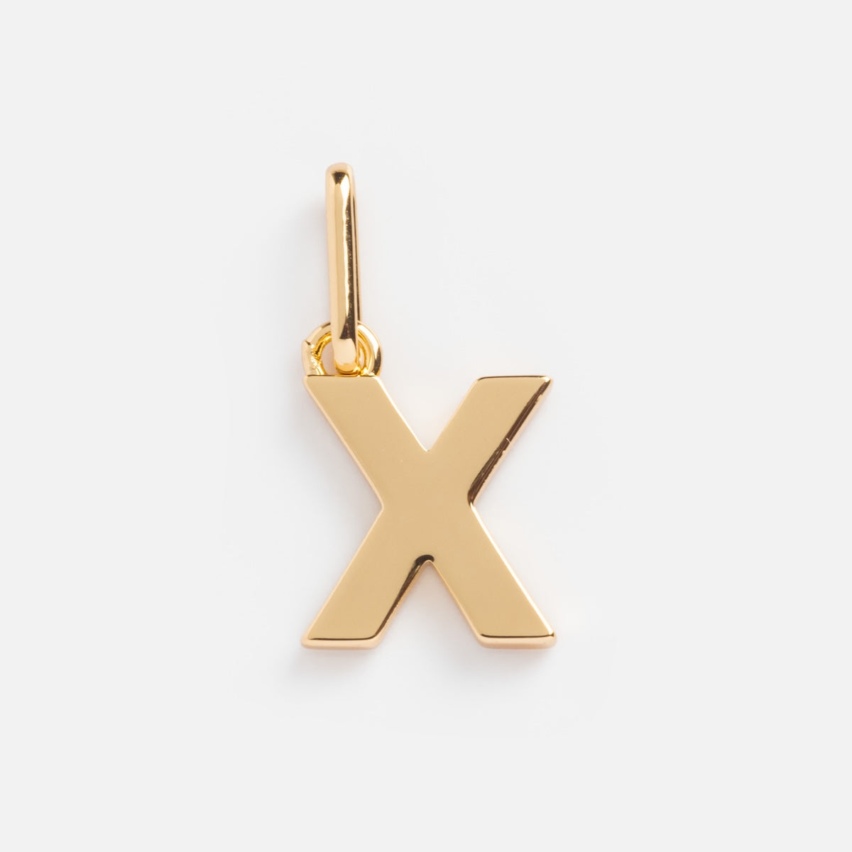 The Be You Initial Charm is a gold, X-shaped pendant with a polished finish and a top loop for easy attachment to your favorite necklace or bracelet, shown on a simple white background.