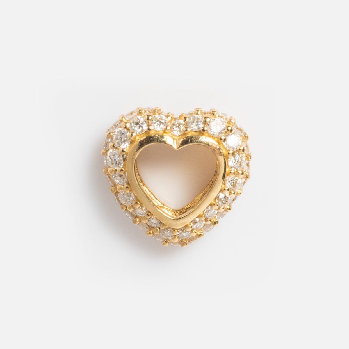 The Solid Gold Lab Diamond Pave Heart Spacer Charm features a heart shape with a hollow center, encrusted with sparkling lab diamonds, and is shown on a plain white background.