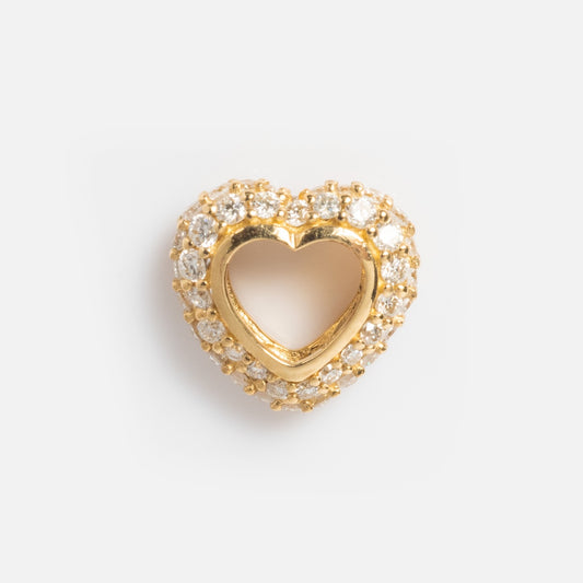 The Solid Gold Lab Diamond Pave Heart Spacer Charm features a heart shape with a hollow center, encrusted with sparkling lab diamonds, and is shown on a plain white background.