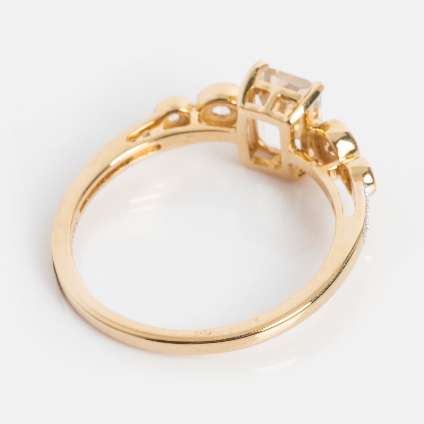 The 14k Vintage Inspired Majesty Ring features a large rectangular white topaz and smaller round accents in an ornate gold setting on a plain band, shown photographed on a white background.