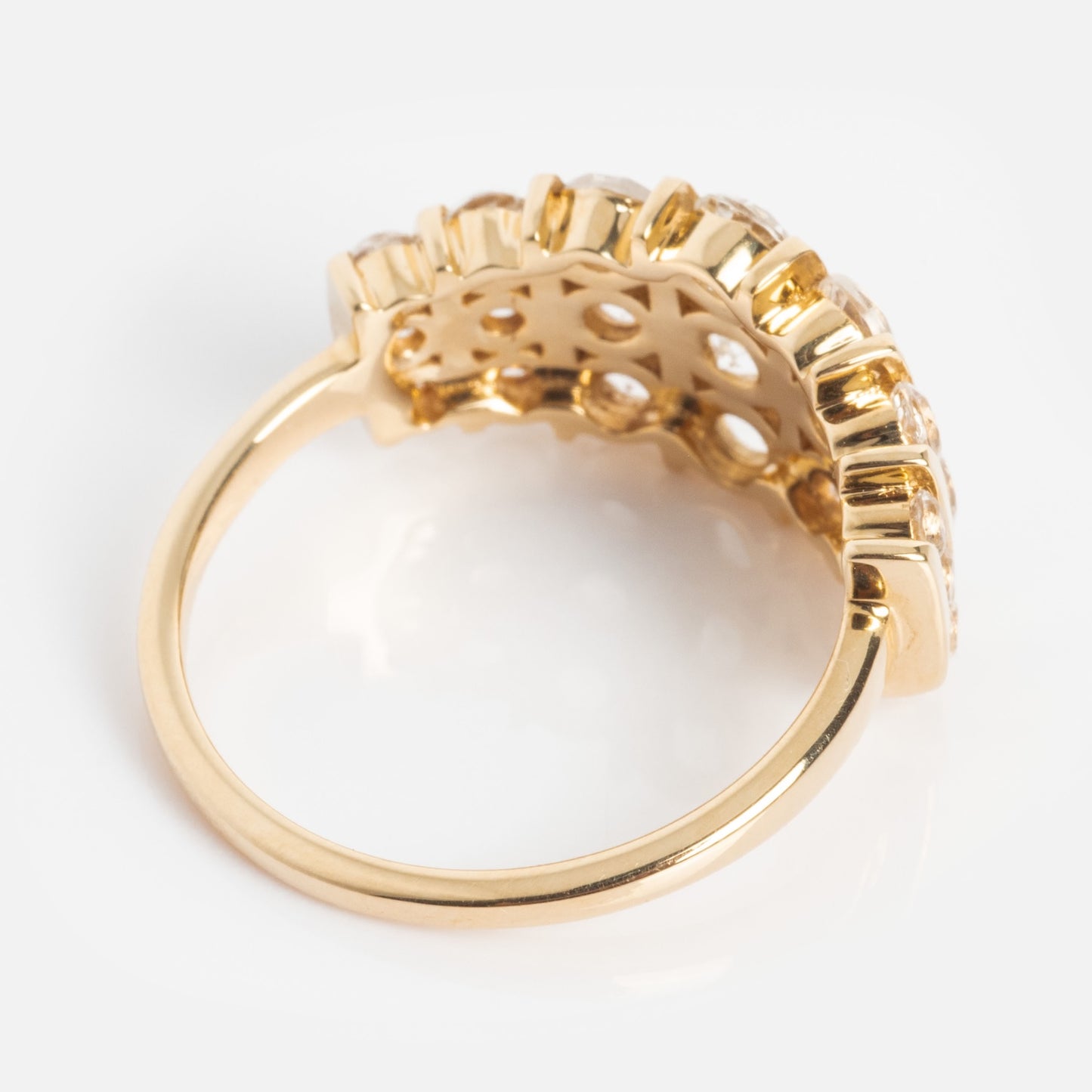A close-up of the 14k Regal White Topaz Statement Ring, featuring multiple rectangular gemstones in a raised, crown-inspired setting, shown from the side on a white background.