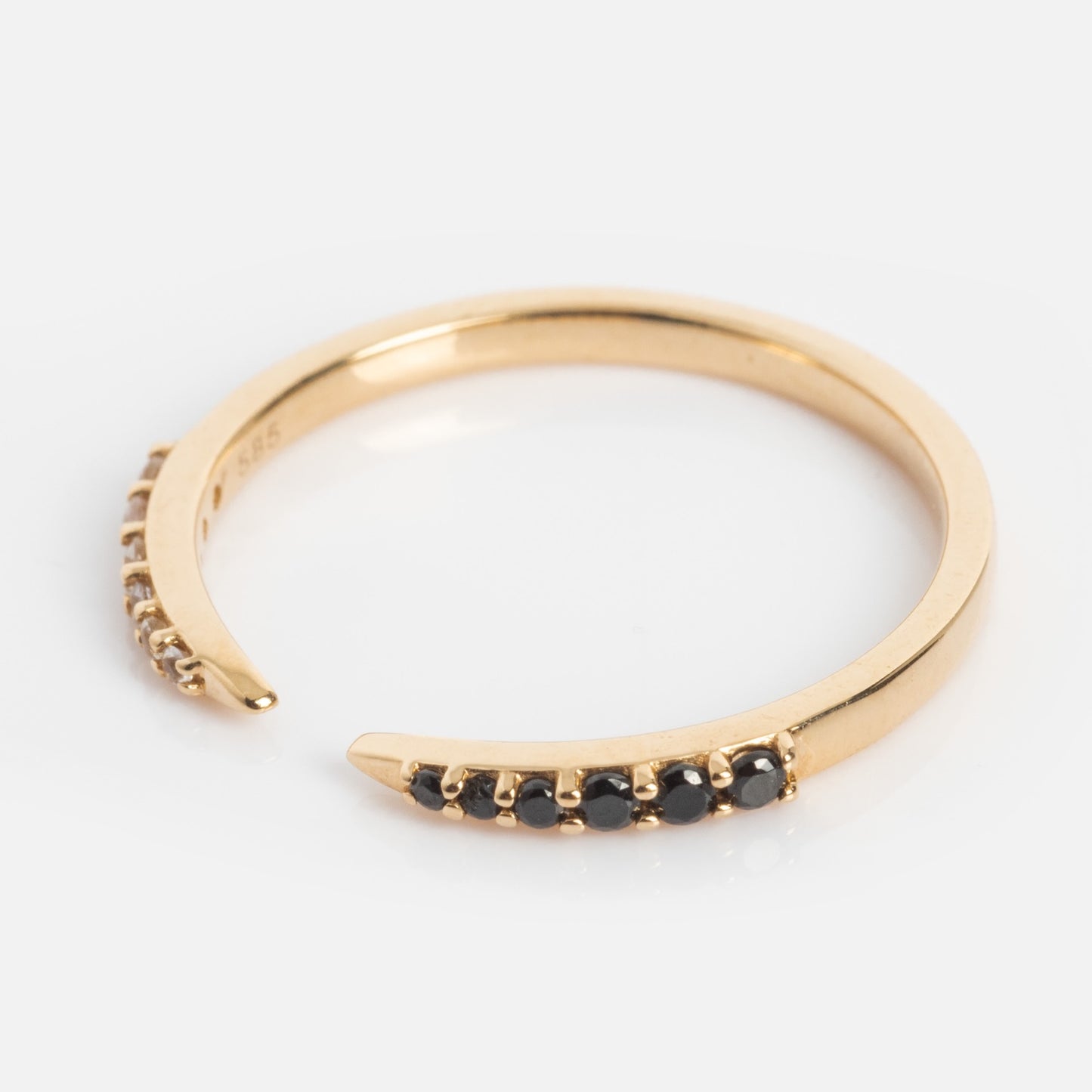 The 14k Black and White Open Front Nesting Band features a row of small, round black stones set along the tapered ends—perfect as a nesting band, shown against a white background.