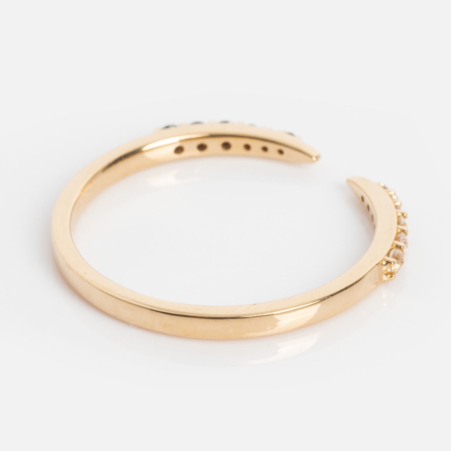 The 14k Black and White Open Front Nesting Band features small clear gemstones on each end, crafted in 14k gold and shown on a white background. Ideal for stacking or wearing as a nesting band.
