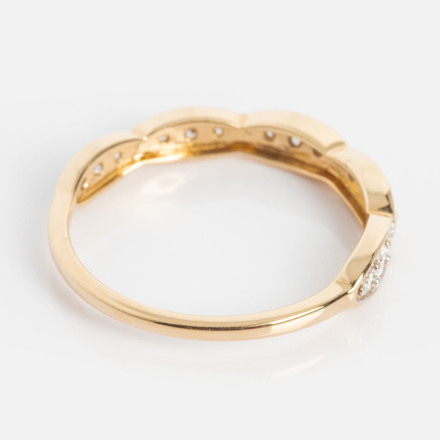 The 14k Vintage Inspired Diamond Stacking Band is a solid yellow gold ring with a scalloped design and small diamonds set along the top curve, shown on a white background.