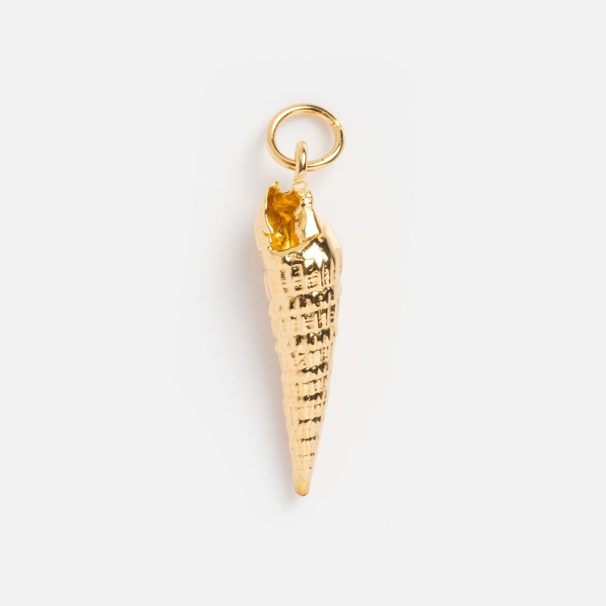 The Charms by I Like It Here Club gold seashell pendant features 12k yellow gold plating and a small top loop for easy attachment to necklaces or bracelets. Shown on a plain white background.