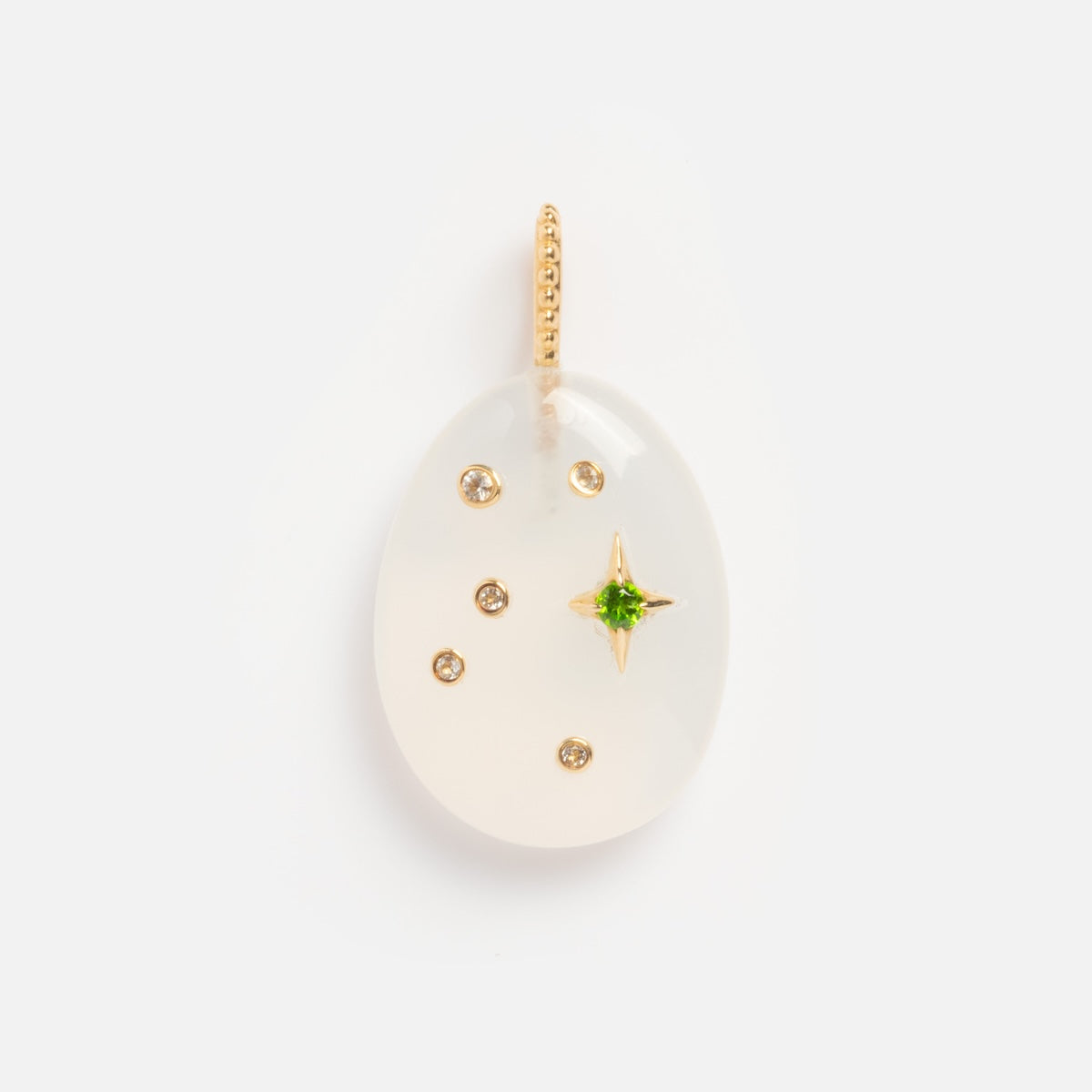 The Solid Gold Zodiac Constellation Crystal Charm features an oval white gemstone, a central green crystal in a gold star-shaped setting, and five round diamonds—making it a standout addition to any zodiac jewelry collection.