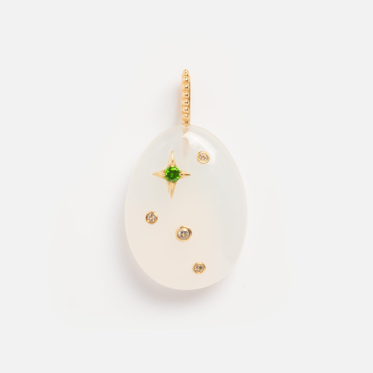The Solid Gold Zodiac Constellation Crystal Charm features an oval white pendant with gold accents, a central green gemstone in a gold star, and three small round gems on a gold beaded loop—ideal for personalized zodiac jewelry.