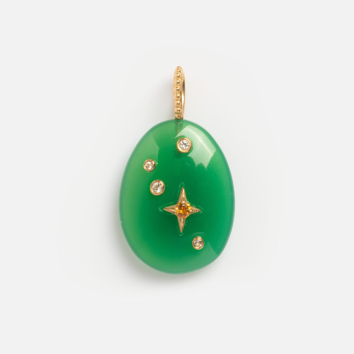 The Solid Gold Zodiac Constellation Crystal Charm is an oval green pendant with a gold loop, featuring a star-shaped design and four gemstones—making it a unique piece of personalized zodiac jewelry.