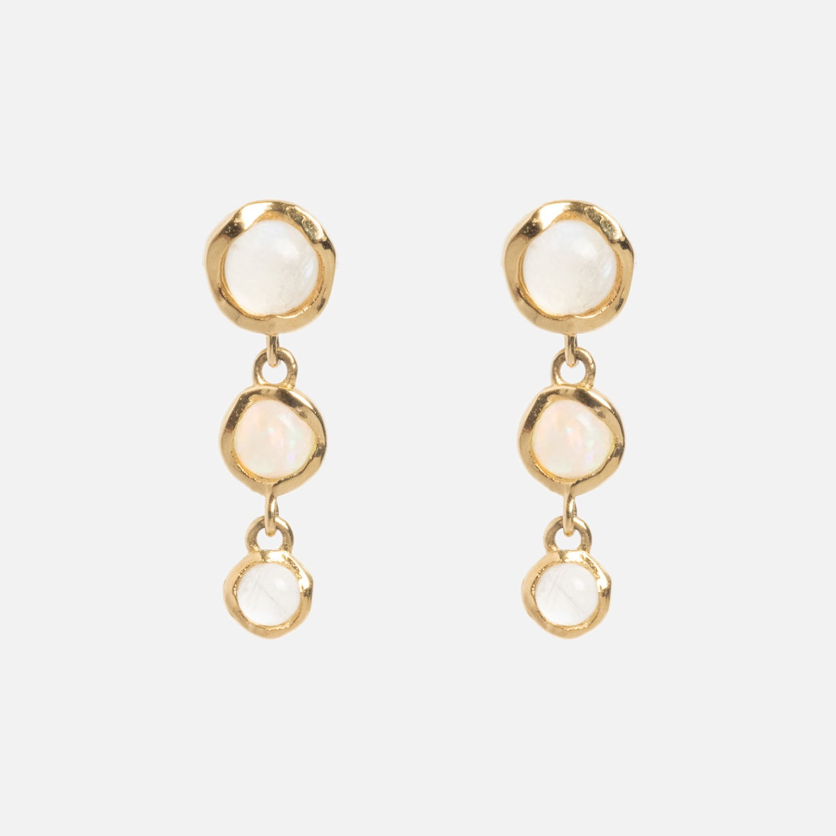 A pair of Solid Gold Horizon Moonstone and Opal Drop Earrings, each featuring three round, white stones arranged vertically, shown on a plain white background.